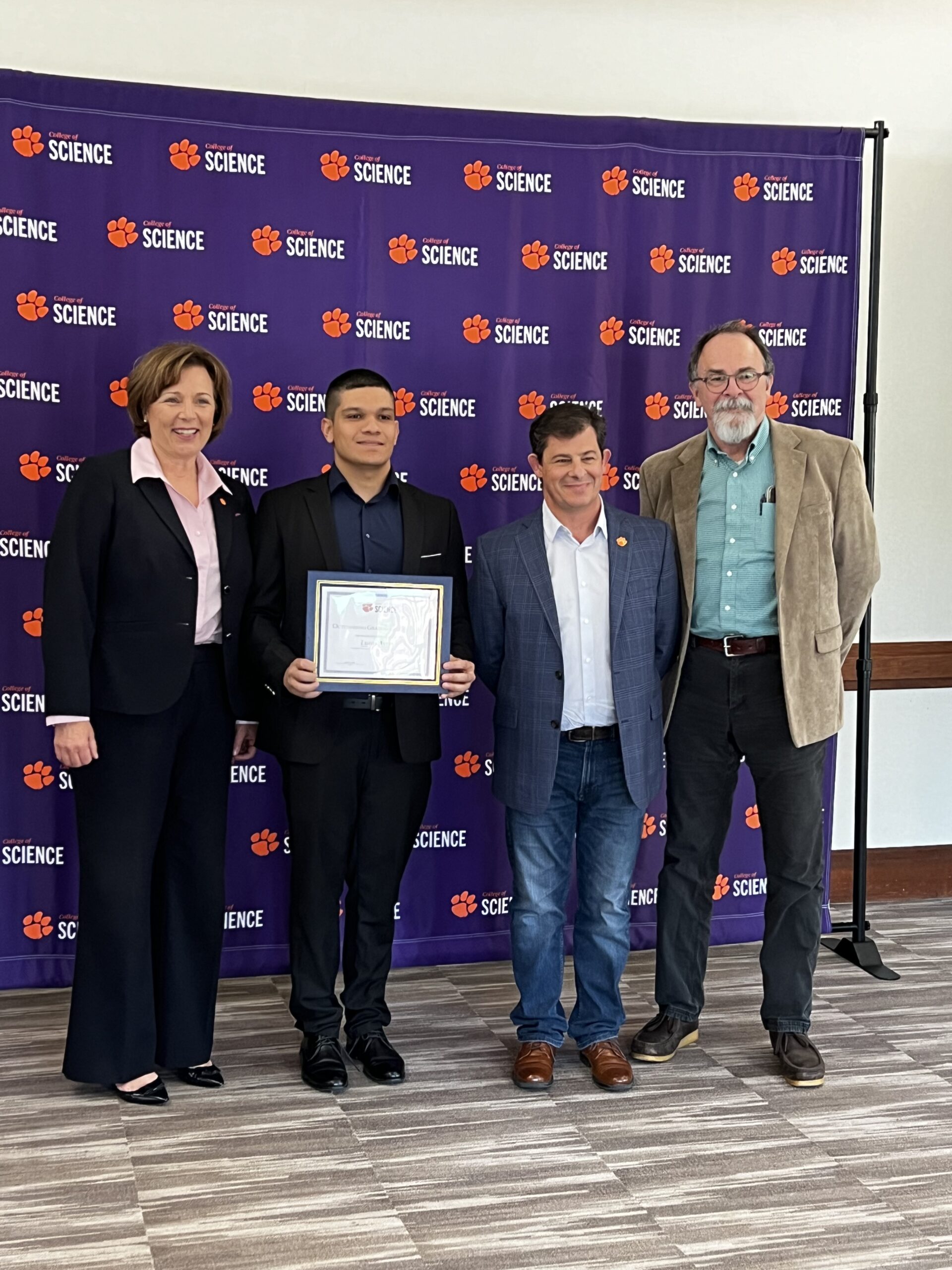 Picture of Dr. Ayres receiving an award